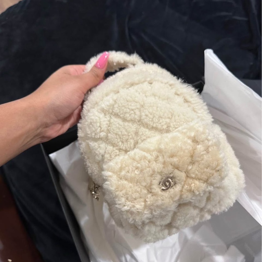 CHANEL Cream Shearling Mini Backpack with CC Flower Accent